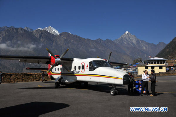 The file photo taken on Dec. 3, 2009 shows a plane of Agni air parking at the Lukla airport, east of Kathmandu, capital of Nepal. A small plane of Agni Air has crashed in Makwanpur district, southwest of Kathmandu, in central Nepal early Tuesday morning, killing 15 people, local media reported. The exact cause of the accident is not known, but officials suspect bad weather could have led to the crash. [Bimal Gutam/Xinhua]