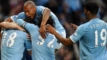 Manchester City's Gareth Barry (L) celebrates scoring with his teammates during their English Premier League soccer match against Liverpool at the City of Manchester stadium in Manchester, northern England, August 23, 2010.