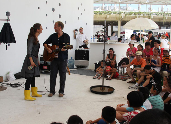 Musicians help celebrate the Little Mermaid&apos;s 97th birthday at the Denmark Pavilion in Shanghai Expo Park, Aug 23, 2010. [Xinhua]