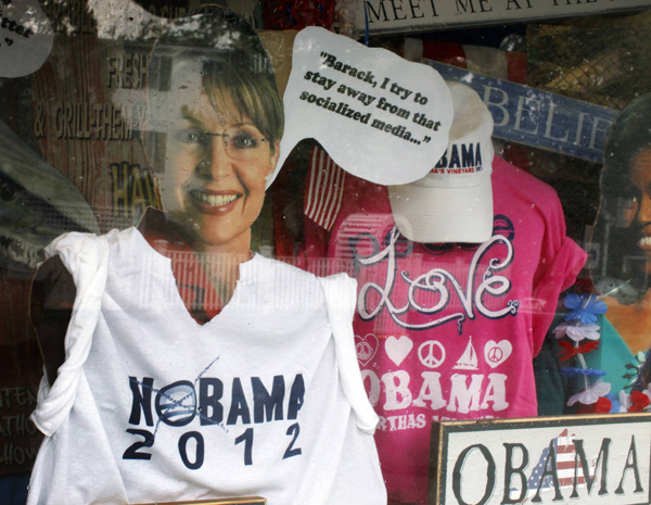 A cutout of former Alaska Governor Sarah Palin wears a &apos;NOBAMA 2010&apos; T-shirt in a shop window display in Edgartown, Massachusetts August 23, 2010.[Xinhua/Reuters]