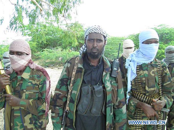 Spokesman of the Islamist Al Shabaab movement Sheikh Ali Mohamoud Rageh (C) makes an announcement at the group's base in Mogadishu, Somalia, Aug. 23, 2010. Al Shabaab declared an all-out war against African Union peacekeeping forces and Somali government troops in Mogadishu on Monday. At least 40 civilians were killed and 106 others wounded in the lastest fierce clashes in Mogadishu. [Ismail Warsameh/Xinhua]