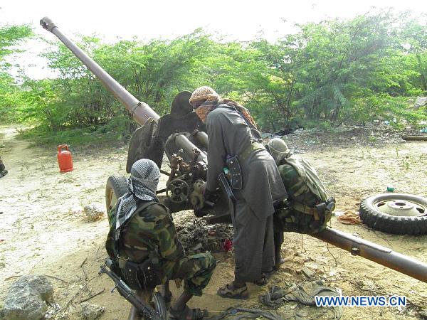 Members of the Islamist Al Shabaab movement prepare an artillery machine at their base in Mogadishu, Somalia, Aug. 23, 2010. Al Shabaab declared an all-out war against African Union peacekeeping forces and Somali government troops in Mogadishu on Monday. At least 40 civilians were killed and 106 others wounded in the lastest fierce clashes in Mogadishu. [Ismail Warsameh/Xinhua] 