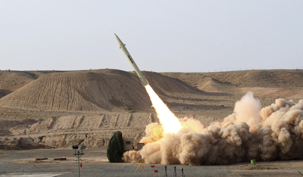 An undated handout picture released by Iran's defence ministry on August 25, 2010 shows a third generation of Fateh 110 (Conqueror) surface-to-surface missile being launched during a test from an unknown location in Iran.[Xinhua]
