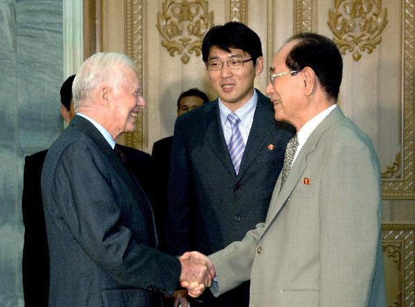 This photo released by official news agency of the Democratic People's Republic of Korea (DPRK) KCNA shows Kim Yong Nam (R), president of the Presidium of the Supreme People's Assembly of the Democratic People's Republic of Korea (DPRK), meets with former U.S. president Jimmy Carter in Pyongyang, Aug. 25, 2010. [Xinhua]