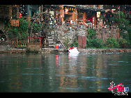 Photo exhibit the beauty of the ancient town of Phoenix, which is located in the Phoenix County in the Tujia and Miao ethnic minority Autonomous Prefecture in Hunan province. Built adjacent to the Tuo River, it is a national historical and cultural town with a long history and many places of interest. The town has been named 'the most beautiful whistle stop' in china. [Photo by Yang Nan]