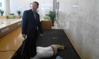 A Microsoft employee grabbed Zhou by the leg