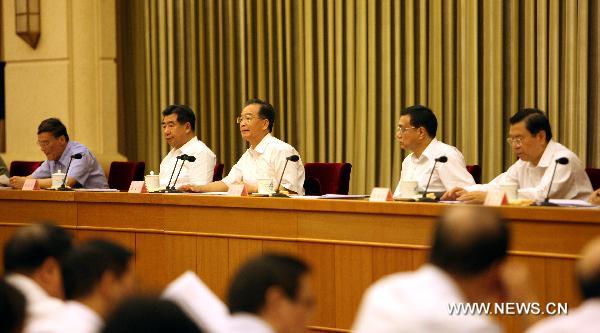 Chinese Premier Wen Jiabao (3rd R) delivers an important speech during a national meeting on lawful administration in Beijing, capital of China, Aug. 27, 2010. [Yao Dawei/Xinhua]
