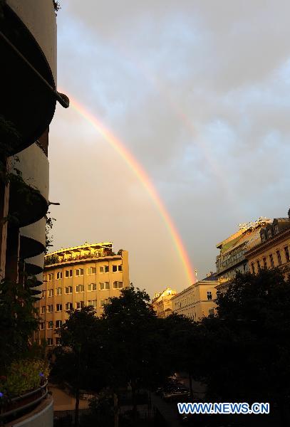 A rainbow is seen in the sky after a shower in Vienna, capital of Austria, Aug. 27, 2010. [Xinhua/Xu Liang]