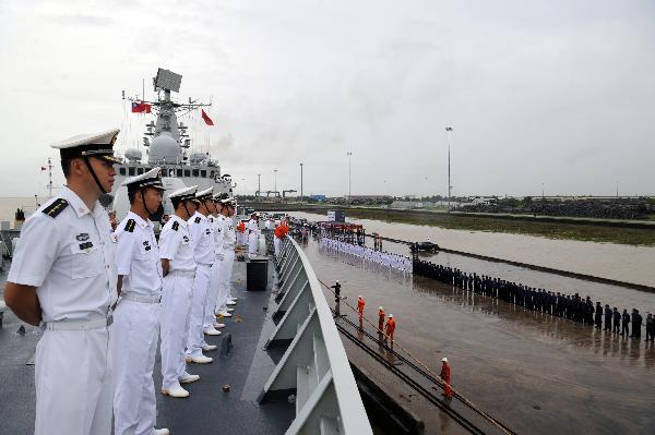 Chinese naval soldiers and officers of destroyer Guangzhou stand in formation on board upon their arrival at Myanmar Yangon's Thilawa Port, Aug. 29, 2010. The 5th Escort Task group of the Chinese People's Liberation Army (PLA)-Navy, made up of two warships -- 'Guanhzhou' and 'Chaohu' made a friendly call at Myanmar Yangon's Thilawa Port Sunday afternoon.