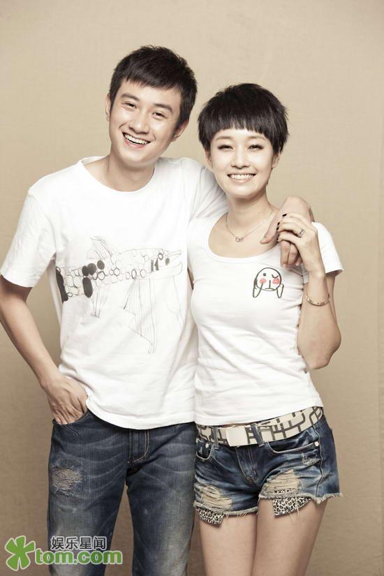 TV star couple Wen Zhang (L) and Ma Yili pose for the first time together for children with autism. Paintings drawn by these children are printed on their T-shirts.