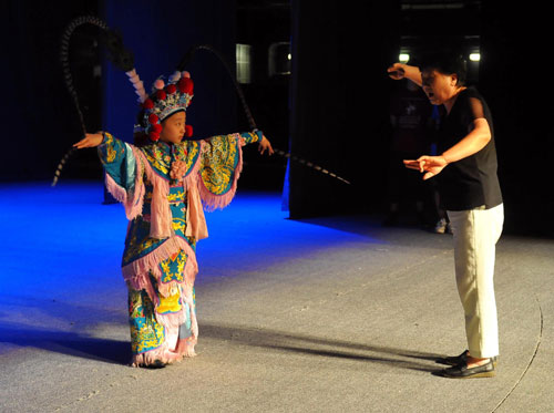 A performer goes through every move of her character during the rehearsal for Red Cliff at the National Center for the Performing Arts, Beijing, Aug 23, 2010. [Xinhua] 