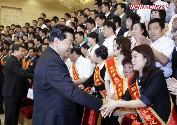 Jia Qinglin (L Front), chairman of the National Committee of the Chinese People's Political Consultative Conference, meets with delegates to the fourth leaguers congress of China Society for Promotion of Guangcai Program (CSPGP) in Beijing, capital of China, Aug. 30, 2010. 