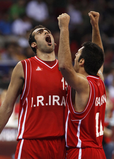 Iran's Hamed Ehadadi (L) celebrates with teammate Oshin Sahakian (R) after he scored and was fouled in the second half of play against Tunisia during their FIBA Basketball World Championship game in Istanbul, Turkey August 30, 2010. (Xinhua/Reuters Photo)