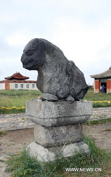 The picture taken on Aug. 13, 2010 shows an ancient stone sculpture standing at Karakorum, the ruined ancient capital of Mongolia. Karakorum locates some 360 kilometers west of Ulan Bator, capital of today's Mongolia. The ruined capital was built in the early 13th century by Ogadai, son of Genghis Khan, but was later destroyed by war. [Xinhua/A Sigang]