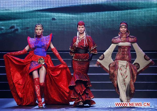 Contestants present ethical dresses at the Fifth Asian Super Model Contest held in Nanning, capital of southwest China's Guangxi Zhuang Autonomous Region, Aug. 30, 2010. The second competition of the Fifth Asian Super Model Contest was held there on Monday. A total of 36 contestants from ten countries and regions attended the contest.