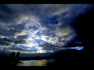 Storm clouds gather over the Fuzhou in East China's Fujian province on August 31, 2010. One typhoon and two tropical storms are forecast to land or brush past East and South China coasts on Tuesday and Wednesday. The converging forces will bring heavy rain to the region as they move further northwest. [Xinhua]