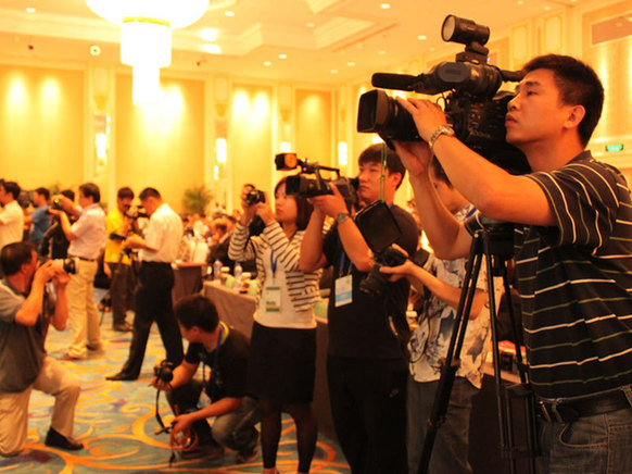 Journalists and reporters cover the opening ceremony of the 1st World Emerging Industries Summit on Sept. 1. [By Wang Ke / China.org.cn]