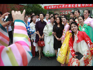 The DPRK performers from Pyongyang Art Troupe, dressed in traditional costumes, at the China Oriental Arts Group in Beijing during their touring trip to China, September 1, 2010. [Xinhua]