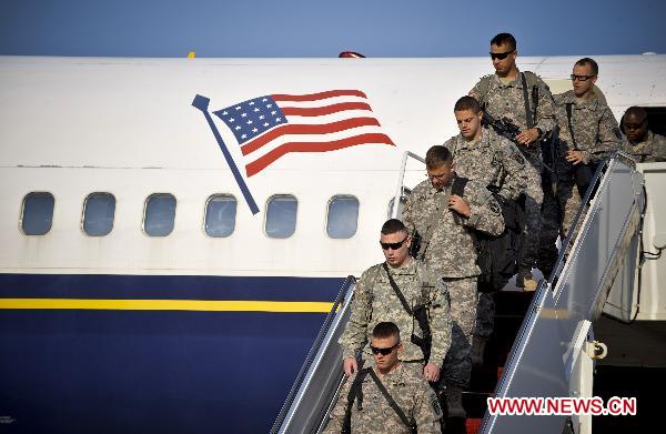 Soldiers of C Company, 1st Battalion, 3rd U.S. Infantry Regiment, returning from a deployment to Taji, Iraq, arrive at the Andrews Joint Base outside Washington D.C., capital of the United States, Aug. 28, 2010. [Zhang Jun/Xinhua]