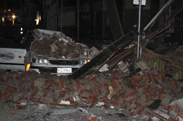A car lies under fallen rubble in Christchurch, New Zealand after a powerful 7.1-magnitude earthquake struck much of New Zealand's South Island early Saturday Sept. 4, 2010. [Xinhua/Reuters]