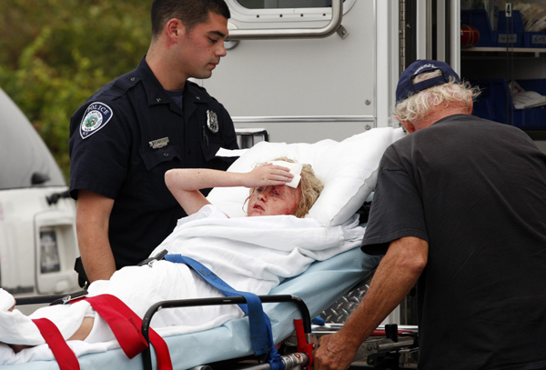 A girl is loaded into an ambulance after being hit by a log which was propelled by a large wave as she watched the ocean ahead of Hurricane Earl in Montauk, New York September 3, 2010. [Xinhua/Reuters]