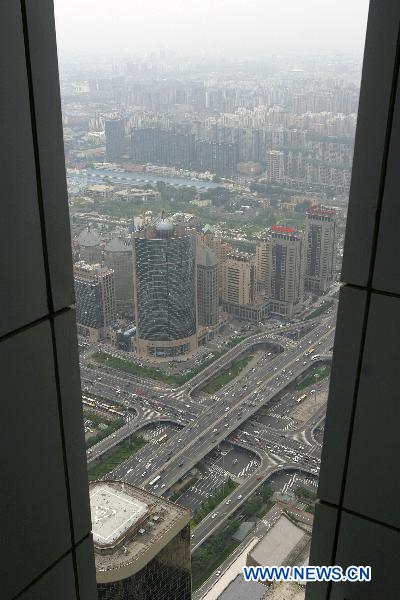 The photo taken on Sept. 3, 2010 shows the overlook of the Central Business District(CBD) from the top floor of the skyscraper China World Trade Center Tower in Beijing, capital of China. As the tallest skyscraper in Beijing, the 330-meter-high China World Trade Center Tower was completed and put into use on Aug. 30. [Xinhua]