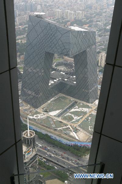 The photo taken on Sept. 3, 2010 shows the overlook of China Central Television(CCTV) complex from the top floor of the skyscraper China World Trade Center Tower in Beijing, capital of China. As the tallest skyscraper in Beijing, the 330-meter-high China World Trade Center Tower was completed and put into use on Aug. 30. [Xinhua]