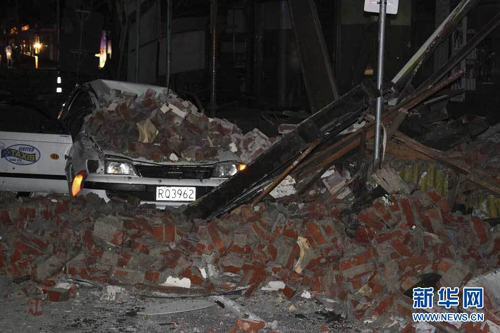 A car lies underllen rubble in Christchurch, New Zealand after a powerful earthquake struck much of New Zealand's South Island early Saturday Sept. 4, 2010. [Xinhua]