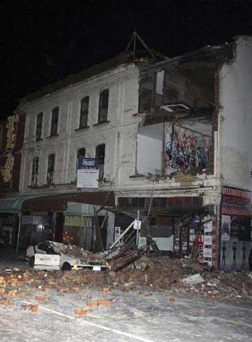 A car hit by fallen rubble in Christchurch, New Zealand after a powerful earthquake struck much of its South Island early Saturday Sept. 4 2010. [Xinhua]