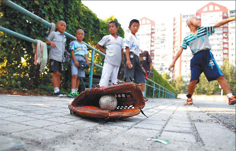 Li Wei says his boys work harder than most because they realize this is their only chance to break through to a successful career on the baseball field.