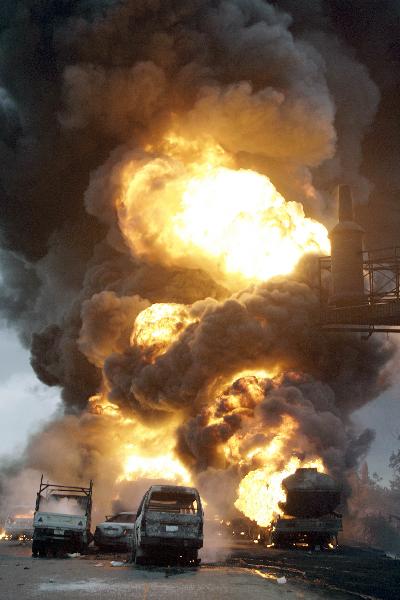 Fire rages at Ibafo Town on Lagos Ibadan highway. More than a dozen vehicles including three fuel tankers and two mini-buses caught fire Sunday in a pile-up on a Nigerian highway, site of a deadly multi-car crash three weeks ago, an AFP photographer reported. [Xinhua/AFP] 