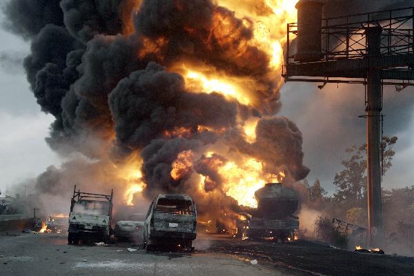 Fire rages at Ibafo Town on Lagos Ibadan highway. More than a dozen vehicles including three fuel tankers and two mini-buses caught fire Sunday in a pile-up on a Nigerian highway, site of a deadly multi-car crash three weeks ago, an AFP photographer reported. [Xinhua/AFP] 