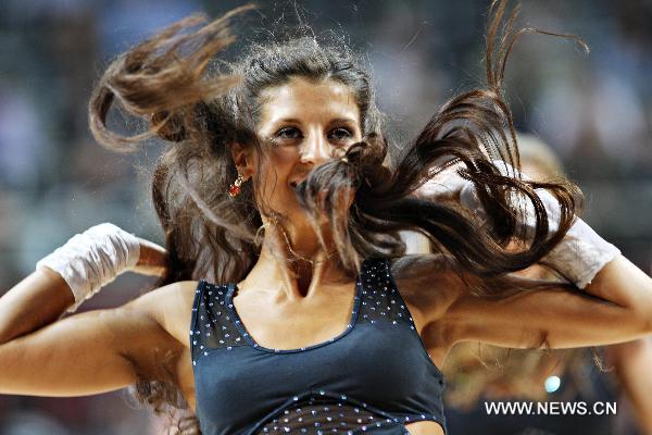 A cheerleader dances during a break in the round of 16 match at the 2010 FIBA Basketball World Championship in Istanbul, Turkey, Sept. 5, 2010. (Xinhua/Cai Yang)