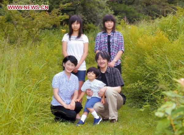 In this photo taken on Aug. 18, 2010 and released by Japan&apos;s Imperial Household Agency on Monday, Sept. 6, 2010, Japanese Prince Hisahito, center, poses with his family members, father Prince Akishino, right, mother Princess Kiko, left, and sister Princesses, Mako, back row right, and Kako, for a family portrait at an imperial villa at Nasu in Tochigi prefecture, north of Tokyo. Hisahito celebrated his fourth birthday on Monday. [Xinhua/AFP