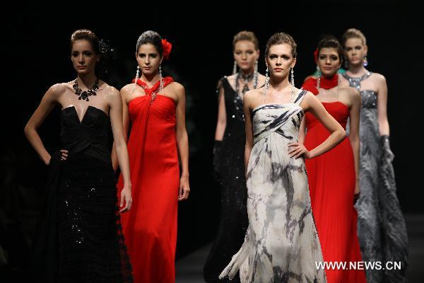 A model presents fashionable styles designed by Pronovias at the world masters fashion show 2010 held in Dalian, a coastal city in northeast China's Liaoning Province, on the night of Sept. 6, 2010.