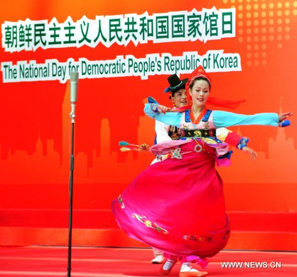 Artists from the Democratic People's Republic of Korea (DPRK) perform duing a ceremony marking the National Pavilion Day for the DPRK at the 2010 World Expo in Shanghai, east China, Sept. 6, 2010. 