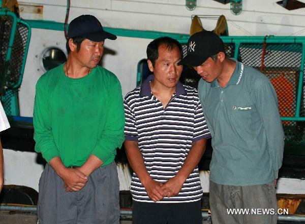 Chinese crew members of South Korean fishing boat &apos;Daeseung 55&apos; Sun Peng (L), Chen Wenxing (C) and Ge Fengqi are seen in Sokcho, South Korea, on Sept. 7, 2010. [Xinhua]