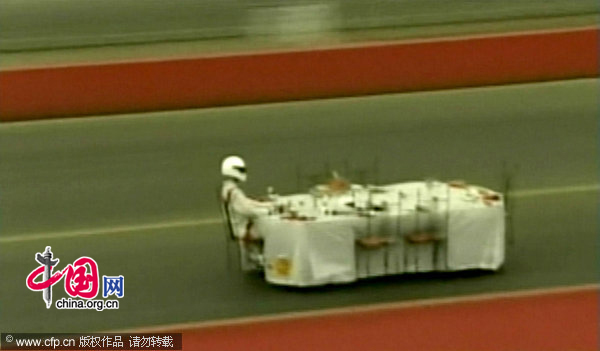 Inventor Perry Watkins is believed to have set a world record for the fastest piece of furniture. The 47-year-old piloted the Queen Anne table, set for a silver service dinner, twice down a 500m track at Santa Pod, Northamptonshire, UK. [CFP]