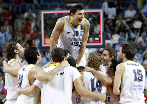 Argentina's Carlos Delfino (top) celebrates with team mates at the end of their game against Brazil during their FIBA Basketball World Championship in Istanbul September 7, 2010. Argentina beat Brazil 93-89.(Xinhua/Reuters Photo)