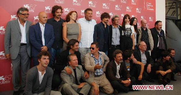 Italian director Mario Martone (5th R rear row) and his cast members pose during a photocall of 'Noi credevamo' at the 67th Venice Film Festival at Venice Lido, Italy, on Sept. 7, 2010.