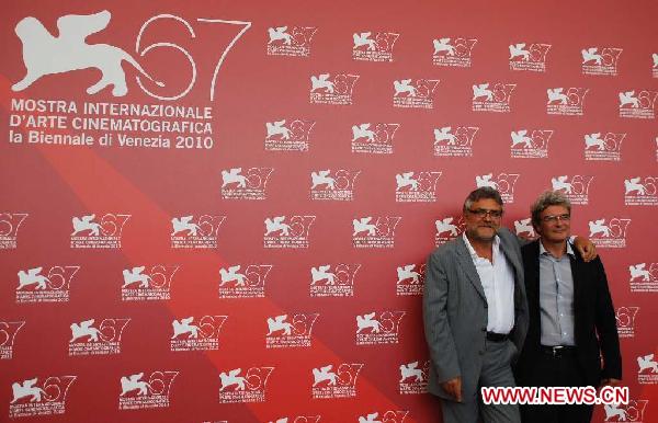 Italian director Mario Martone (R) and screenwriter Giancarlo De Cataldo pose during a photocall of 'Noi credevamo' at the 67th Venice Film Festival at Venice Lido, Italy, on Sept. 7, 2010.