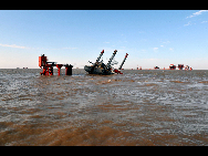 Thirty four workers have been saved and two are still missing after strong wind brougt by typhoon Malou tilted an oil drilling platform in Bohai Bay on September 7, the platform's operator, Shengli Oilfield, a subsidiary of Sinopec, said Wednesday. The valve on the oil rig has been closed and there is no risk of an oil spill, the company said in a statement. [Xinhua]