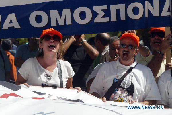 Demonstrators shout slogans in Athens, capital of Greece, Sept. 8, 2010. [Marios Lolos/Xinhua]