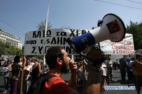 A demonstrator shouts slogans in Athens, capital of Greece, Sept. 8, 2010. [Marios Lolos/Xinhua]