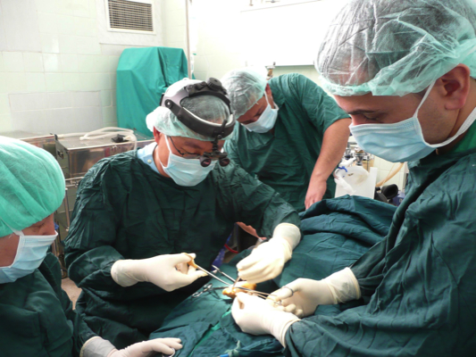 Hong Kong surgeon Dr. Wilson LI (second from the left) operates on a patient in Kurdistan, Iraq. He joined the Médecins Sans Frontières (MSF) mission in Iraq from March to May in 2007 and was the first Hong Kong MSF field worker working in war-torn Iraq.[Wilson LI] 