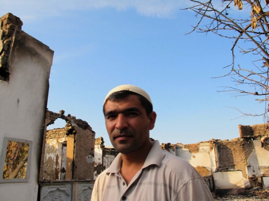 In Kyrgyzstan, Khudai (36) had spent 10 years to build his elegant, vast house. During the violent clashes in the south of Kyrgyzstan in June 2010, his house was burnt into ruined. Now he is staying with neighbours and only comes back very few times in his burnt house. &apos;It is too hard to pass the door and see,&apos; he said.[François DUMONT /MSF] 