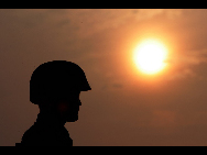 The photo shows the daily life, including the hard military training, of soldiers at a coastal defense fortress under the jurisdiction of People's Liberation Army (PLA) Jinan Military Command. [China Daily]