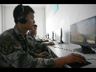 The photo shows the daily life, including the hard military training, of soldiers at a coastal defense fortress under the jurisdiction of People's Liberation Army (PLA) Jinan Military Command. [China Daily]