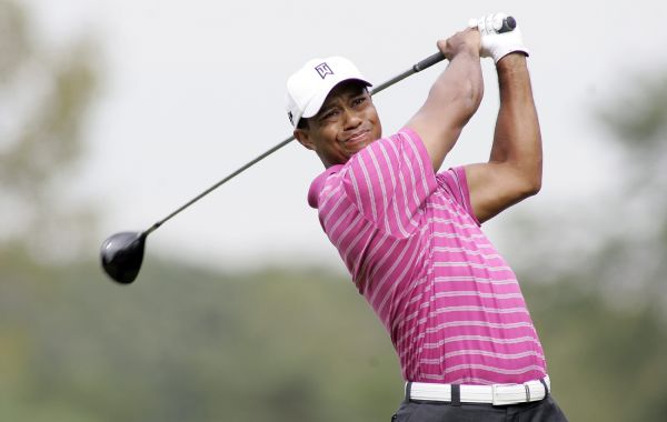 Woods hits a tee shot on nine during the first round of the BMW Championship golf tournament in Lemont Tiger Woods of the U.S. hits a tee shot on the ninth hole during the first round of the BMW Championship golf tournament in Lemont, Illinois September 9, 2010. (Xinhua/Reuters)