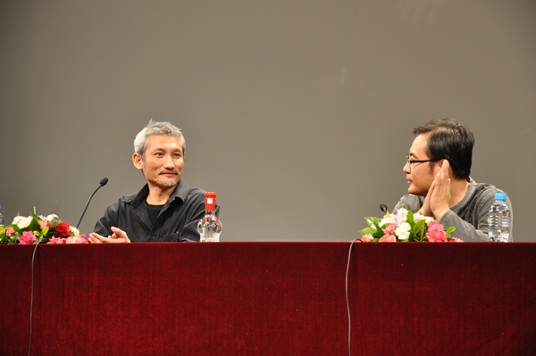Director Tsui Hark (left) meets with students at the Beijing Film Academy on Thursday, September 9, 2010.